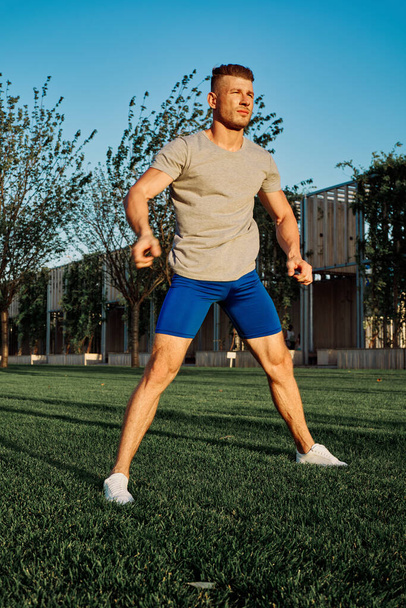 sporty man workout in park crossfit exercise summer - Foto, Imagen