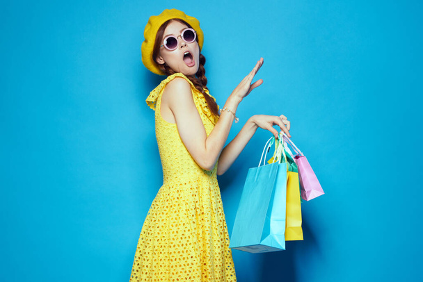glamorous woman wearing sunglasses posing shopping fashion studio model - Fotografie, Obrázek