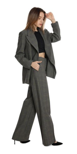 Full length portrait of beautiful young woman in fashionable suit on white background. Business attire - Valokuva, kuva