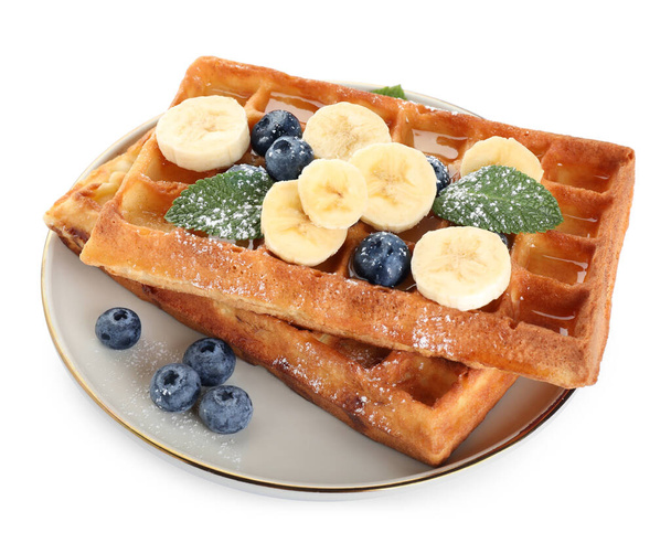 Delicious Belgian waffles with blueberries and banana on white background - Foto, imagen