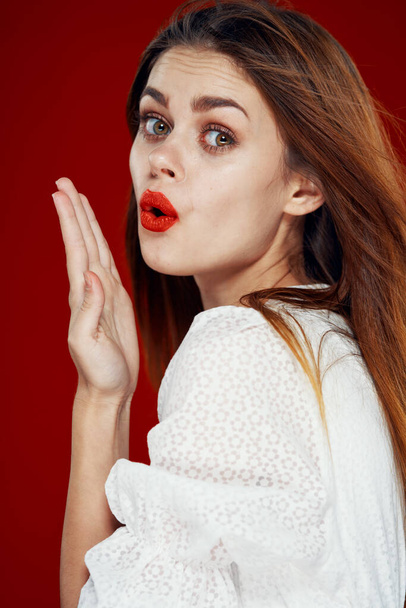 fashionable woman with red lips in red white dress isolated background - 写真・画像