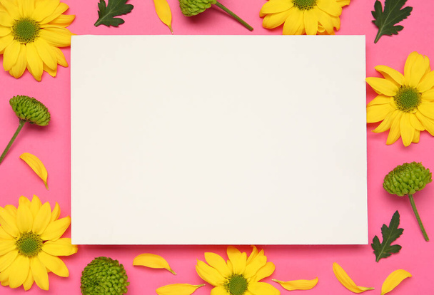 Beautiful chrysanthemums and blank card on pink background, flat lay. Space for text - Photo, image