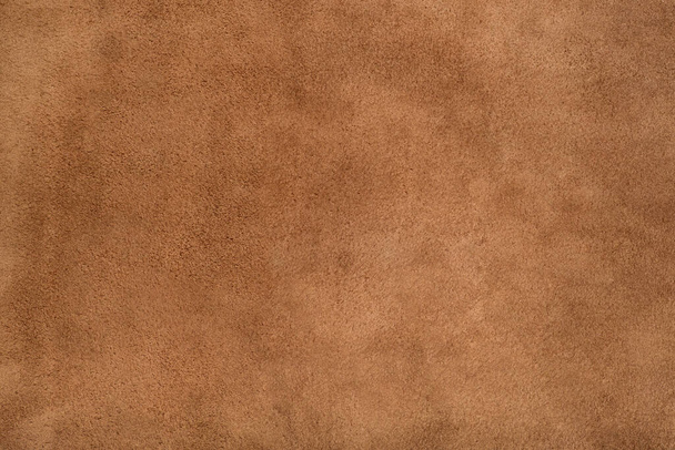 Brown suede leather texture background, genuine leather, top view. Suede texture - skin animal. Texture for design. Can be used as background wallpaper and background for design-works. - Photo, Image
