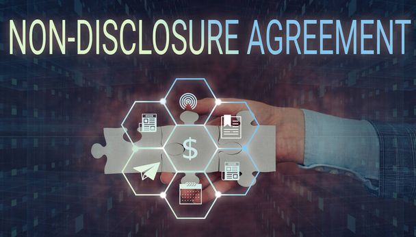 Text sign showing Non Disclosure Agreement. Word for Legal Contract Confidential Material or Information Hand Holding Jigsaw Puzzle Piece Unlocking New Futuristic Technologies. - Photo, Image