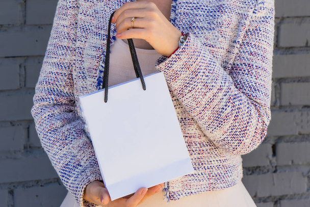 Woman with gift white bag - Photo, Image