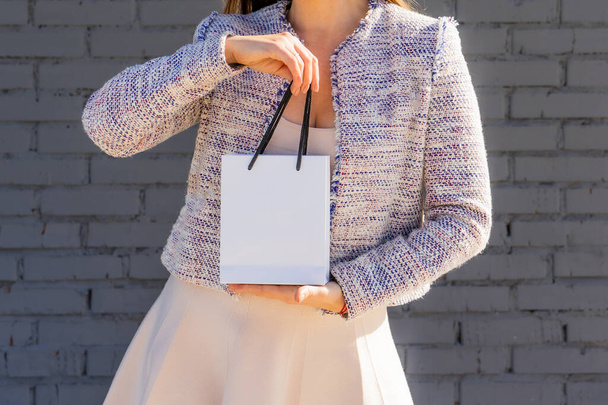 Woman with gift white bag - Photo, Image