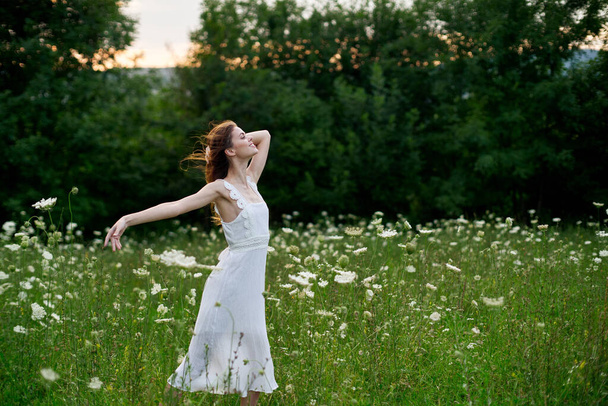 Woman in white dress posing dance nature summer - Fotografie, Obrázek
