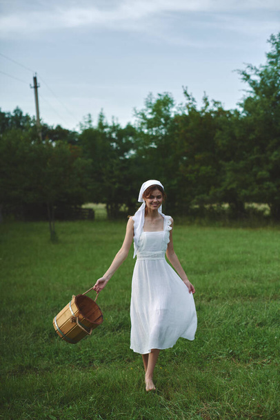 Woman in white dress countryside village nature ecology - Φωτογραφία, εικόνα