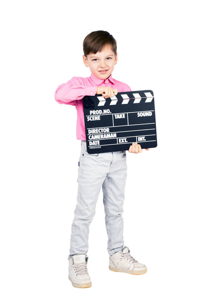 Little boy with clapper board isolated on white background - Фото, изображение