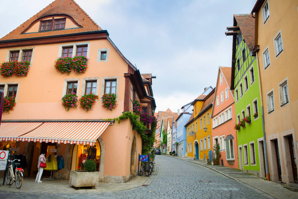 The old clock tower on the streets of the fairy tale town of Rothenburg, Germany - 写真・画像