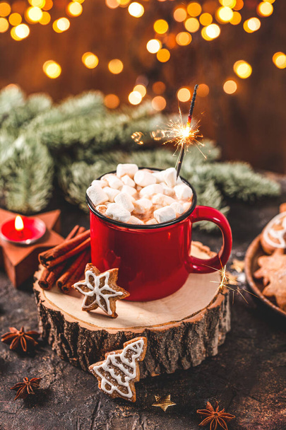 A red mug of cocoa with marshmallows and Christmas cookies in a New Years setting. Cozy Christmas card, vertical photo - Foto, Imagem
