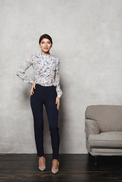 Young model woman in trendy blouse, trousers and in high heels shoes - Foto, afbeelding
