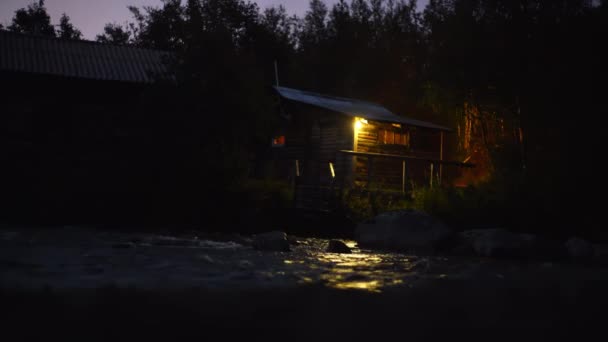 Cozy country house at night on the riverbank - Footage, Video