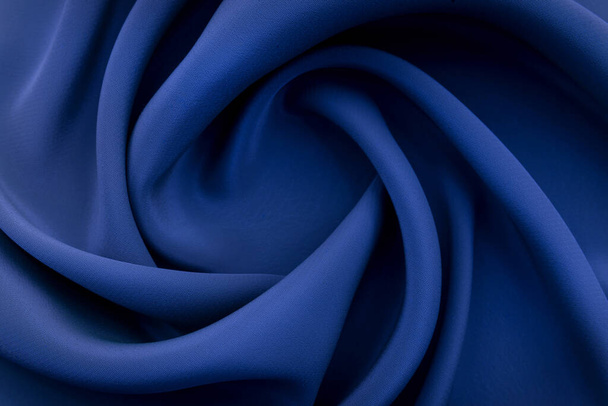 A piece of burgundy, violet, blue cloth. Fabric texture for background and design works of art, beautiful wrinkled pattern of silk or linen. A crumpled piece of cloth - Foto, Imagem