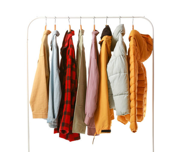Rack with different stylish jackets on white background - Photo, Image