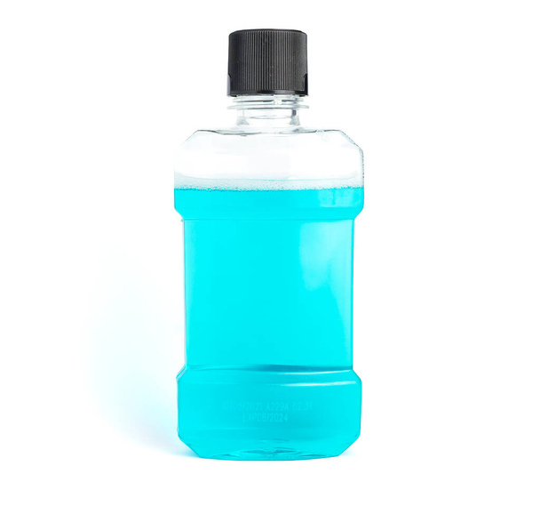 An image isolated clear blue mouthwash in clear plastic bottles is a chemical solution for cleaning your mouth in the morning or after eating with clipping path. - 写真・画像