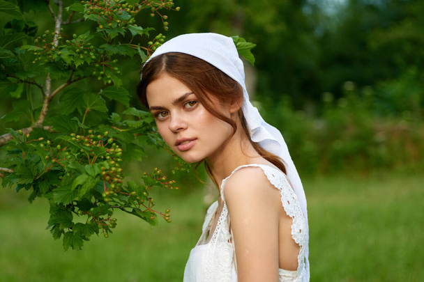Woman in white dress in the village outdoors Green grass Farmer - Valokuva, kuva
