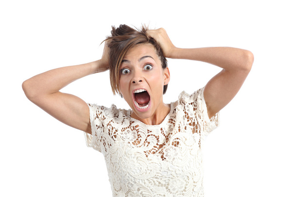 Front view of a scared woman screaming with hands on head - Fotoğraf, Görsel