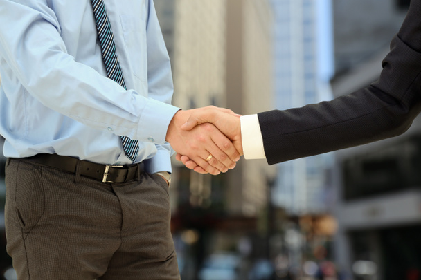 Close-up image of a firm handshake  between two colleagues outsi - Photo, Image