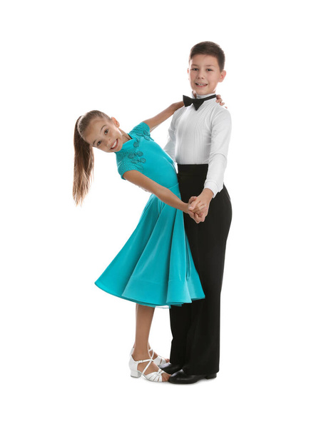Beautifully dressed couple of kids dancing on white background - Zdjęcie, obraz