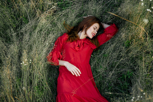 woman in red dress nature green grass landscape rest - Φωτογραφία, εικόνα
