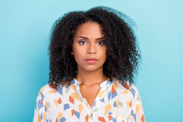 Photo of serious millennial brunette lady wear white shirt isolated on blue color background - Foto, afbeelding