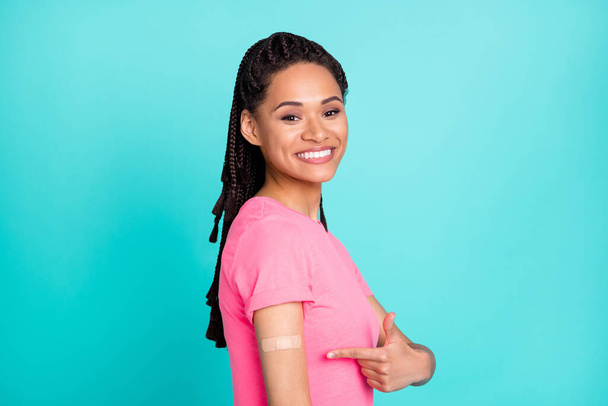 Profile photo of excited brunette hairdo young lady point vaccination wear t-shirt isolated on teal color background - Foto, imagen