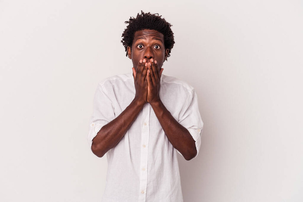 Young african american man isolated on white background  shocked covering mouth with hands. - Fotó, kép