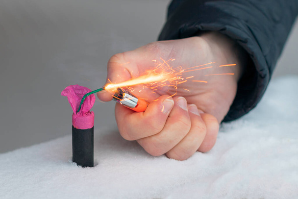 Guy Sets Fire to the Flash Noise Firecracker Outdoors - 写真・画像