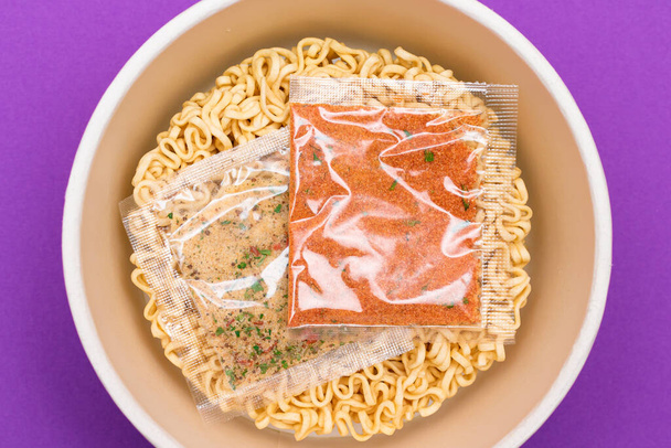 Opened Package with Uncooked Instant Noodles on Violet Background - Zdjęcie, obraz