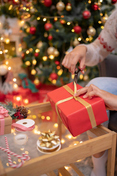 Woman with gift and present for Christmas and New Year party at home. - Foto, Imagem