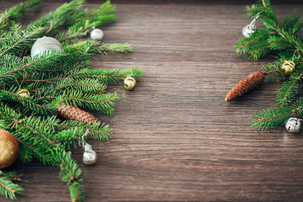 Christmas Tree Branches on a Brown Background with CopySpace for Text - Photo, Image