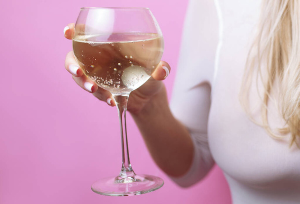 Sexy girl with big breasts drinking wine from a glass - Zdjęcie, obraz