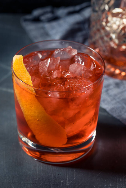 Boozy Refreshing Tequila La Rosita Negroni Cocktail with a Grapefruit Garnish - 写真・画像