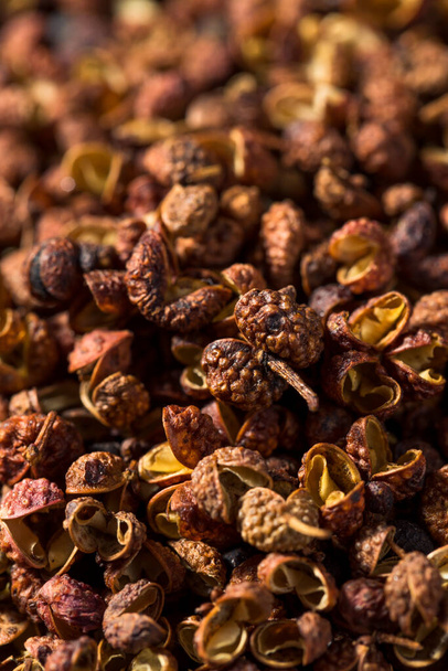 Raw Red Organic Sichuan Peppercorn in a Bowl - Photo, image