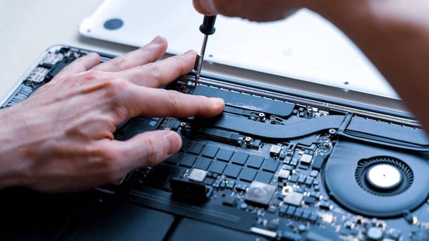 Maintenance pc. Maintenance repair engineer support. Computer technician service with laptop on hardware background. Electronic technology development concept - Photo, Image
