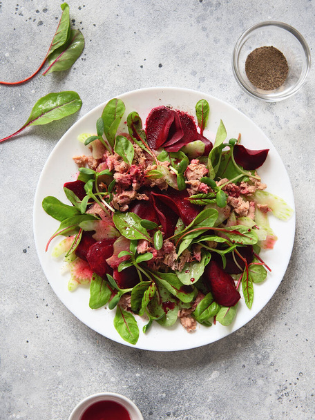 Healthy fresh salad. Beetroot, red chard and canned tuna salad. Healthy Meal recipe preparation. Plant-based dishes. Green living. Vegetarian recipes. Food styling. Organic food. Vegetarian cuisine - Photo, Image