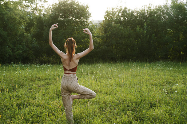 woman in a field outdoors summer meditation fresh air - Foto, Imagem