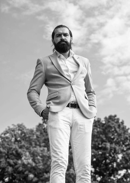his perfect style. bride groom outdoor. groomed brutal hipster in stylish clothes. male beauty and fashion. confident businessman with beard and moustache. mature man in formal elegant suit - Photo, image