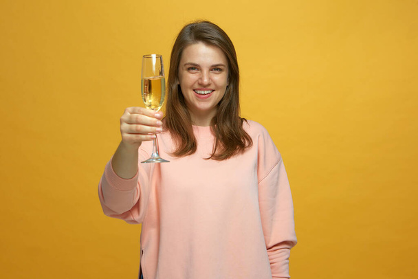 Festive toast. Smiling young girl with fizz champagne glass, clink by bubbly, celebrating xmas holiday or birthday party - Zdjęcie, obraz