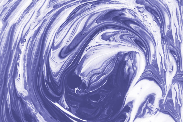 Abstract purple or violet and white fluid background with swirls and waves pattern. Mixed liquid acrylic paint toned in trendy Very Peri color of the year 2022. Monochrome marble texture - Photo, Image