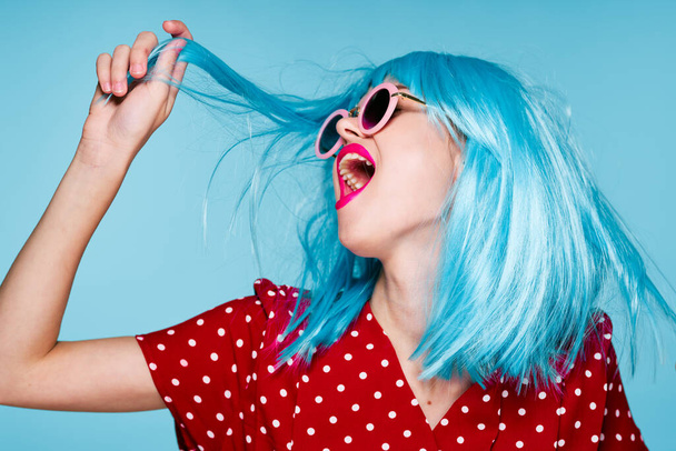 emotional glamorous woman on blue wig fashion glasses posing - Photo, Image