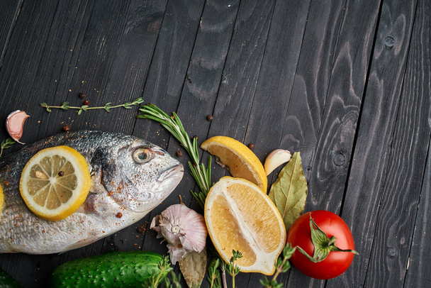 fish on wooden board ingredients lemon fresh food sea food - Photo, Image