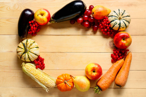 Frame made of different healthy food on wooden background. Harvest festival - Фото, зображення
