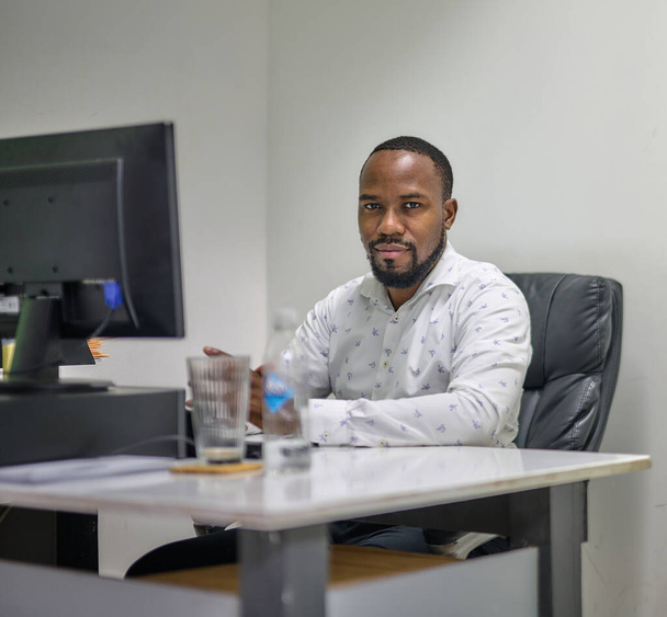 A young African American CEO working in his office - Fotografie, Obrázek