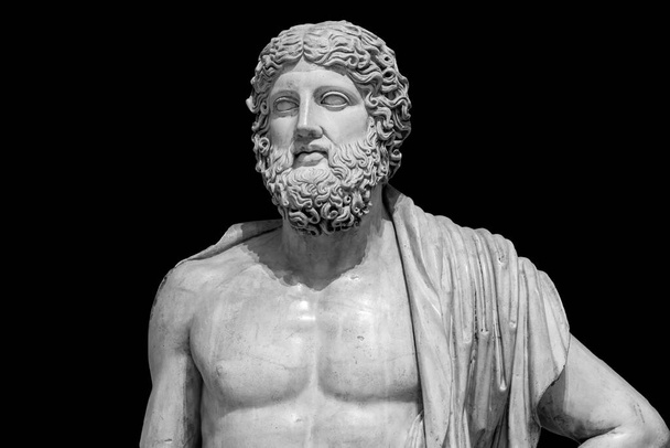 Marble statue of greek god Zeus isolated on black background. Antique sculpture of man with beard - Fotografie, Obrázek