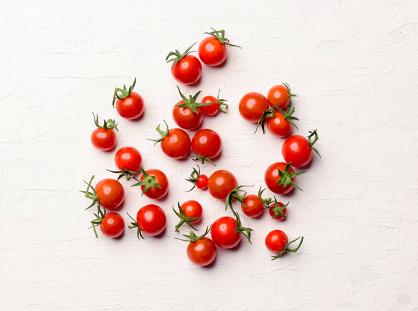 A closeup shot of a bunch of cherry tomatoes isolated on a white background - Valokuva, kuva