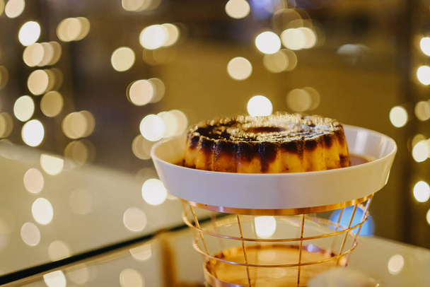 A view of delicious dessert on the plate and bokeh lights in the background - Фото, изображение