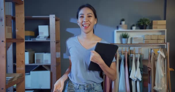Professional attractive cheerful young Asia successful lady owner teenage with casual hold tablet show product smile with confident look at camera in shop at night. New business concept. - Footage, Video