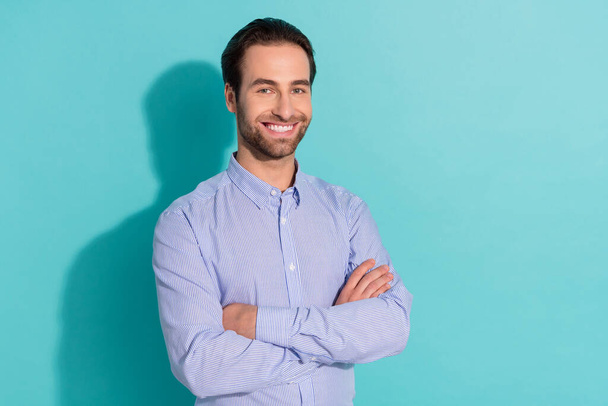 Photo of nice glad self-assured sales manager guy folded hands wear violet shirt isolated teal color background - Photo, Image